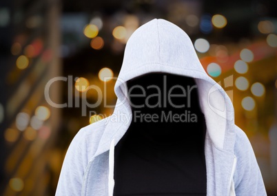 Anonymous Criminal Man in hood in front of night city