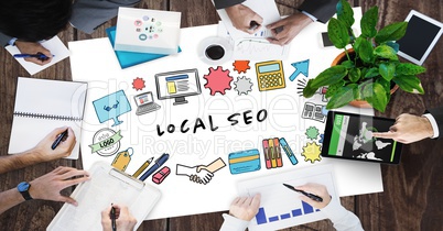Cropped image of business people working with local SEO text surrounded by graphics