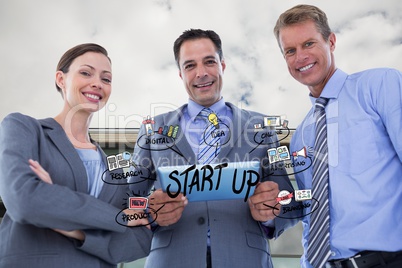 Happy business people with tablet PC representing start up concept