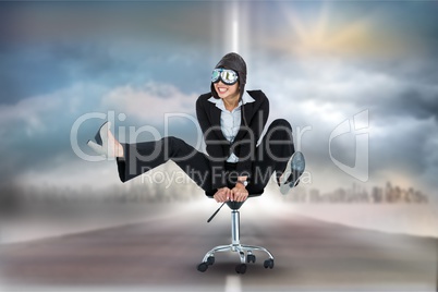 Digitally generated image of businesswoman with goggles on office chair at road against sky