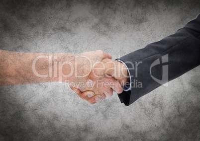 Handshake against grey grunge background