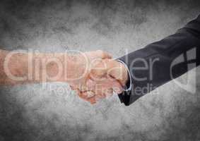 Handshake against grey grunge background