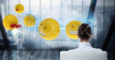 Digital composite image of businesswoman with emojis in office