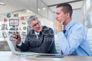 Digital composite image of business people discussing with various icons in office