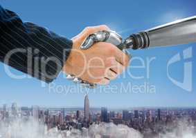 Android Robot hand shaking businessman hand with blue city background