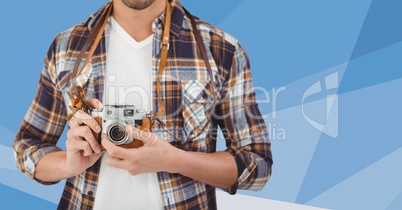 Man mid section with camera against blue vector mesh