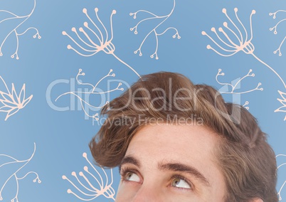 Top of man's head against blue background with white floral pattern