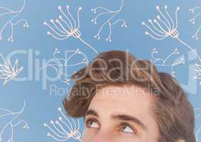 Top of man's head against blue background with white floral pattern