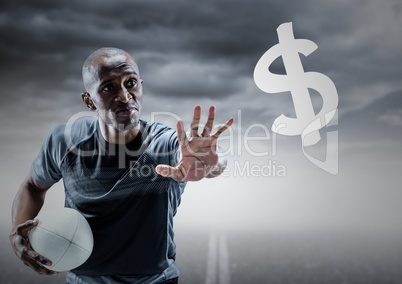 Rugby player with hand out towards dollar sign against road and stormy sky