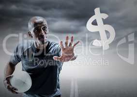 Rugby player with hand out towards dollar sign against road and stormy sky