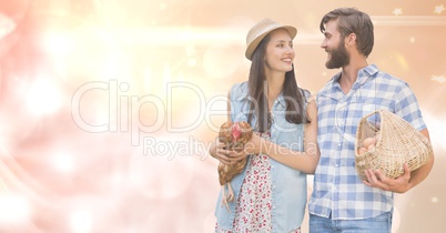 Couple with hen and eggs over bokeh