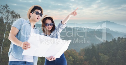 Travelers holding map on mountain