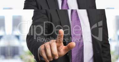 Midsection of businessman pointing