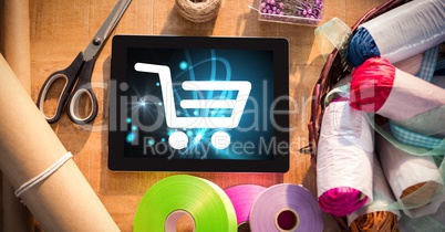 Shopping cart icon on digital tablet by craft products