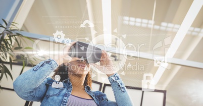 Digital composite image of woman using VR glasses