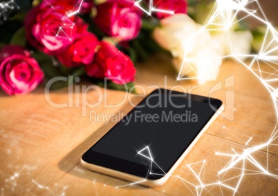 Phone on table with roses and white network overlay