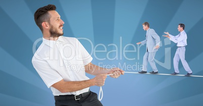 Digital composite image of businessmen walking on rope held by manager