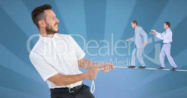 Digital composite image of businessmen walking on rope held by manager