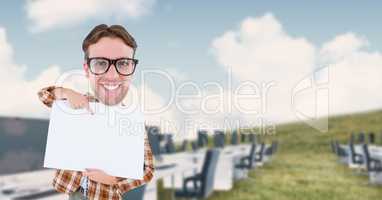 Digital composite image of nerd businessman pointing at blank placard