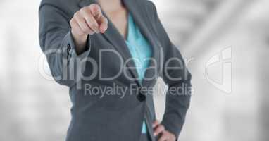 Midsection of businesswoman pointing