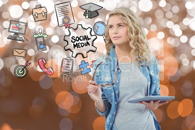 Woman holding eyeglasses and tablet PC by icons