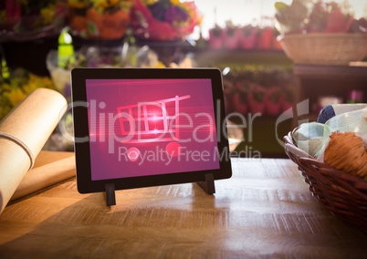 Tablet with Shopping trolley icon in Flower Shop