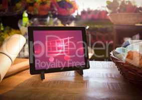 Tablet with Shopping trolley icon in Flower Shop