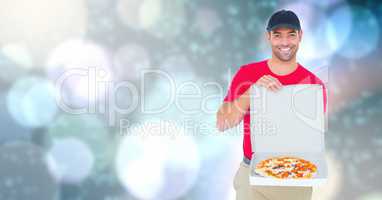 Delivery man showing pizza over bokeh