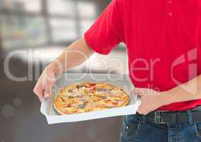 Deliveryman with pizza in the restaurant
