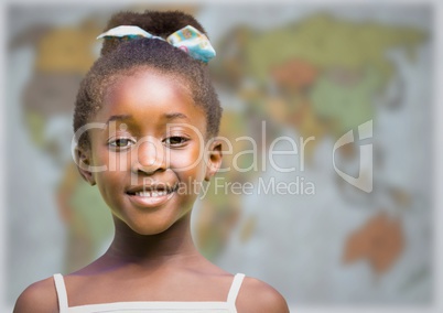 Girl smiling against blurry map