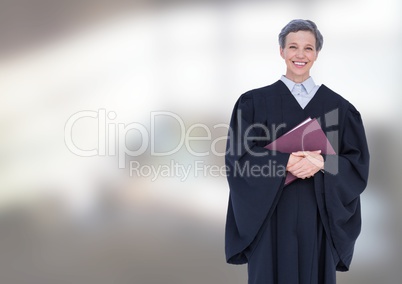 Judge holding book in front of bright background
