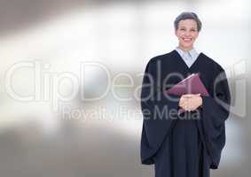 Judge holding book in front of bright background