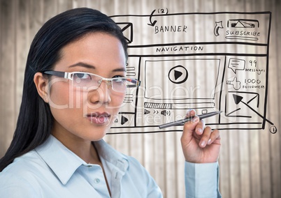 Business woman with pen and website mock up against blurry wood panel