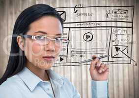 Business woman with pen and website mock up against blurry wood panel