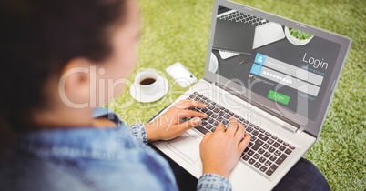 Woman signing up on web page using laptop
