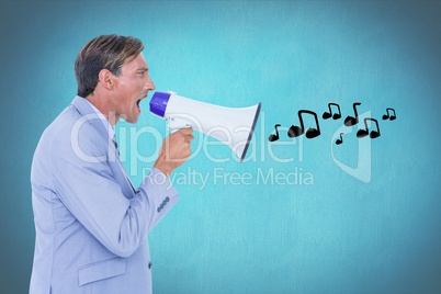 Digitally generated image of businessman shouting on megaphone emitting music icons