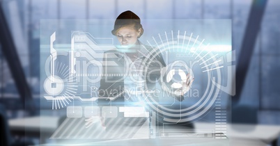 Digital composite image of businesswoman touching futuristic screen while working in office