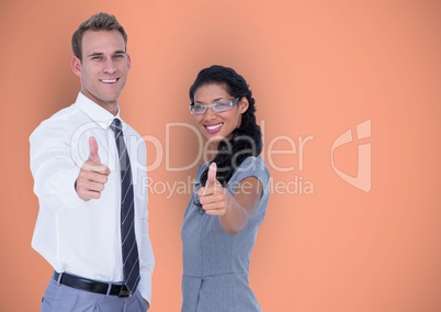 Business people showing thumbs up gesture