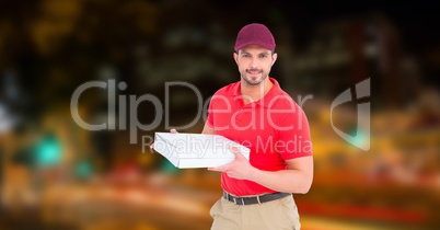 Confident delivery man holding pizza box