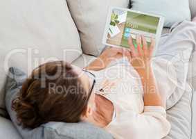 Woman on the sofa with tablet. Login on the screen
