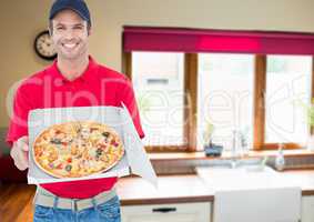 Happy delivery sowing the pizza in the kitchen