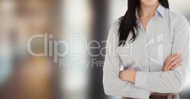 Midsection of businesswoman with arms crossed