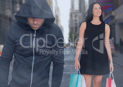 Criminal in hood in front of city street and Walking woman with shopping bags