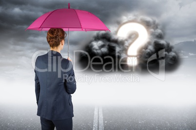 Digitally generated image of businesswoman with umbrella looking at question mark on cloud