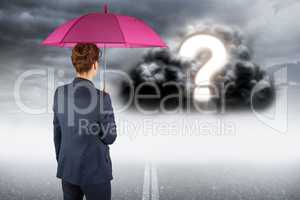 Digitally generated image of businesswoman with umbrella looking at question mark on cloud