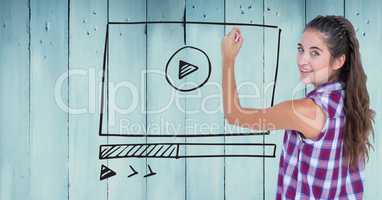 Woman with chalk and website mock up against blue wood panel