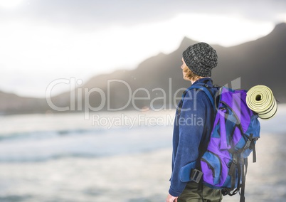 mountain travel, blue jumper men looking to the horizon