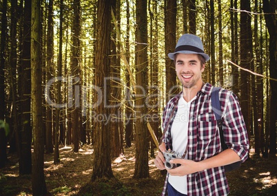 mountain travel, men with hat in the forest