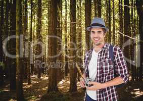 mountain travel, men with hat in the forest