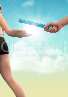 Runner and hand with blue baton against blue and yellow sky with flare